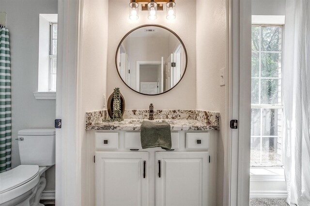 bathroom with vanity and toilet