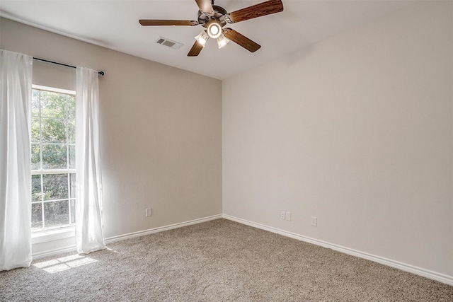 carpeted empty room with ceiling fan