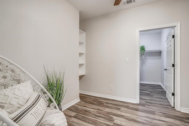 interior space featuring hardwood / wood-style flooring and ceiling fan