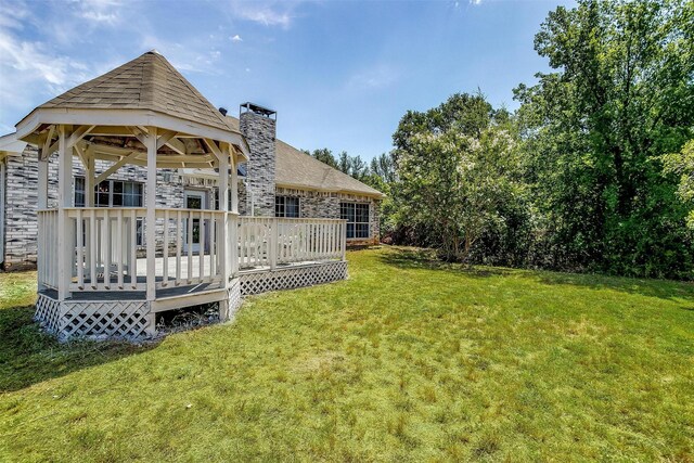 view of yard featuring a wooden deck