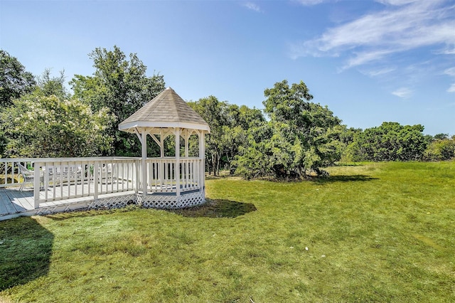 view of yard featuring a deck and a gazebo