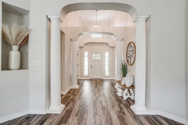 foyer entrance featuring hardwood / wood-style flooring and ornamental molding