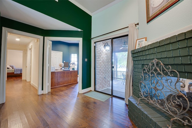 entrance foyer featuring hardwood / wood-style floors and ornamental molding