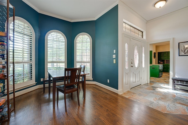 foyer entrance featuring ornamental molding