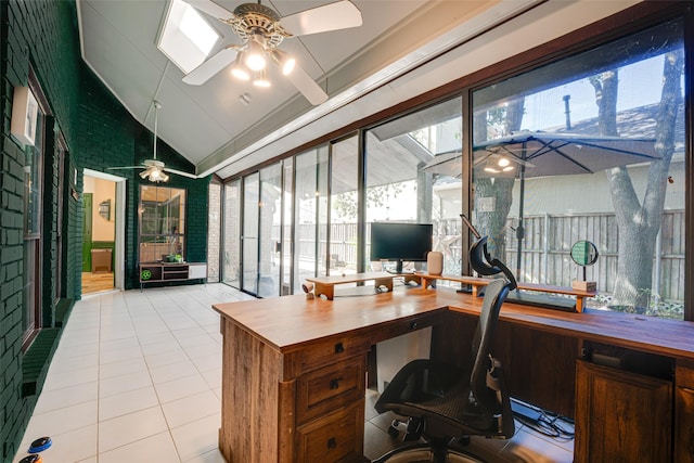 tiled office space featuring ceiling fan and vaulted ceiling