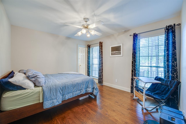 bedroom with ceiling fan and hardwood / wood-style flooring