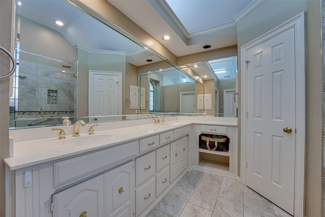 bathroom with vanity, a shower, and crown molding