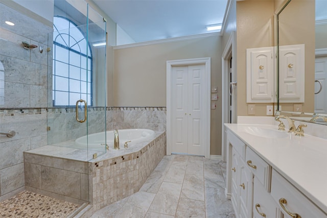 bathroom with vanity and independent shower and bath