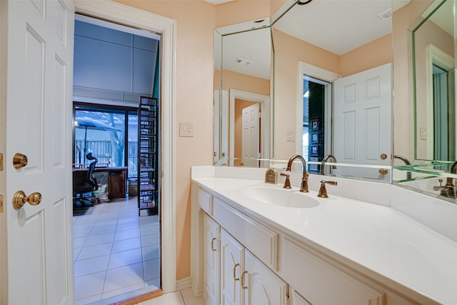 bathroom with tile patterned flooring and vanity