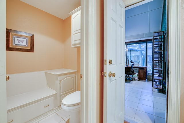 bathroom with tile patterned floors and toilet