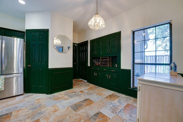 foyer entrance with a notable chandelier