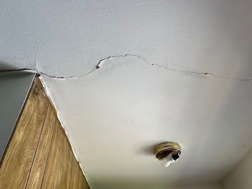 details with a textured ceiling