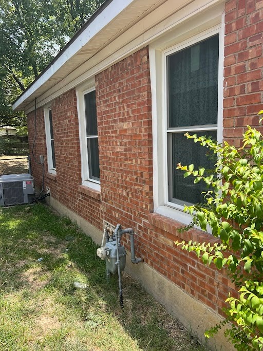 view of property exterior with central AC unit