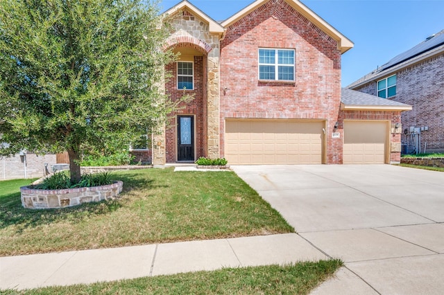 front facade featuring a garage and a front yard