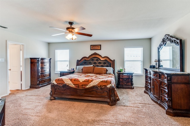 carpeted bedroom featuring ceiling fan