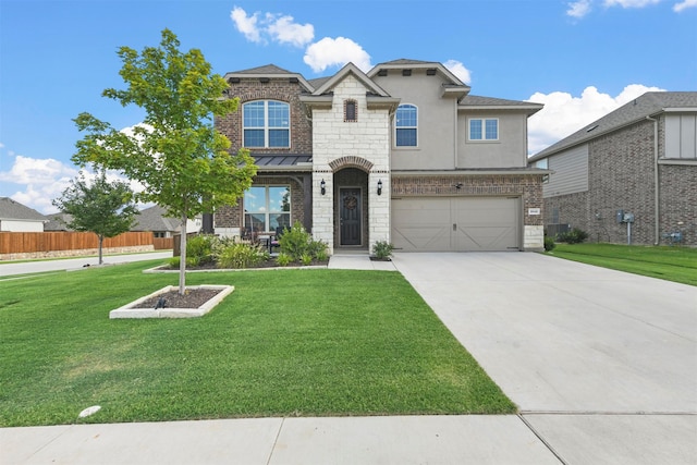 view of front facade with a garage and a front yard