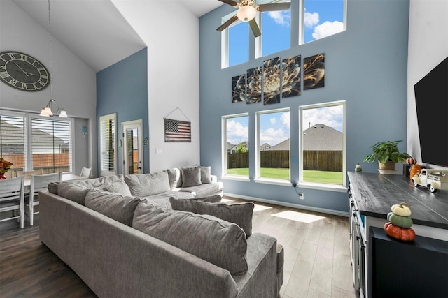 living room with hardwood / wood-style flooring and ceiling fan