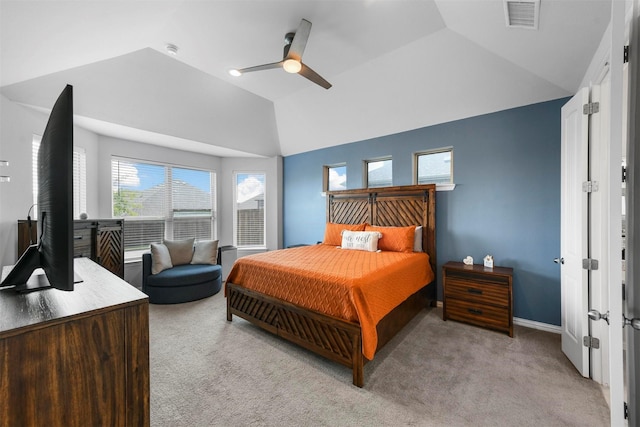 carpeted bedroom with vaulted ceiling and ceiling fan