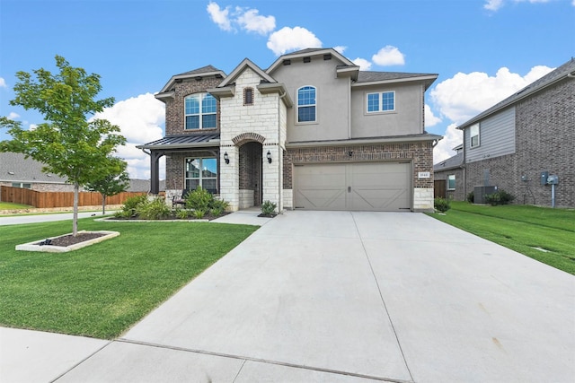 view of front of property with a garage, a front lawn, and central air condition unit