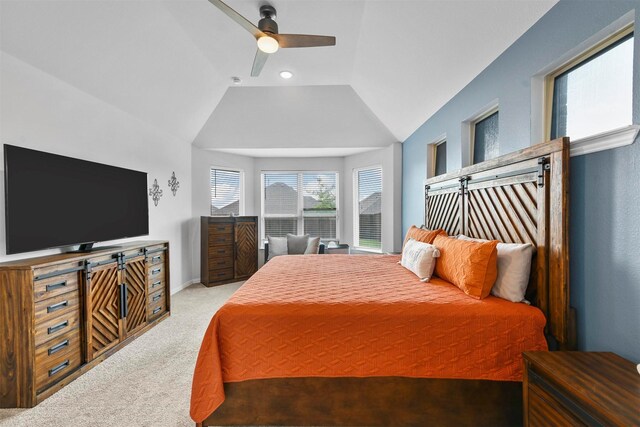 bedroom featuring vaulted ceiling, ceiling fan, and light colored carpet