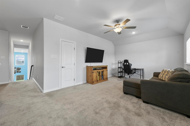 living room featuring ceiling fan, light carpet, and vaulted ceiling