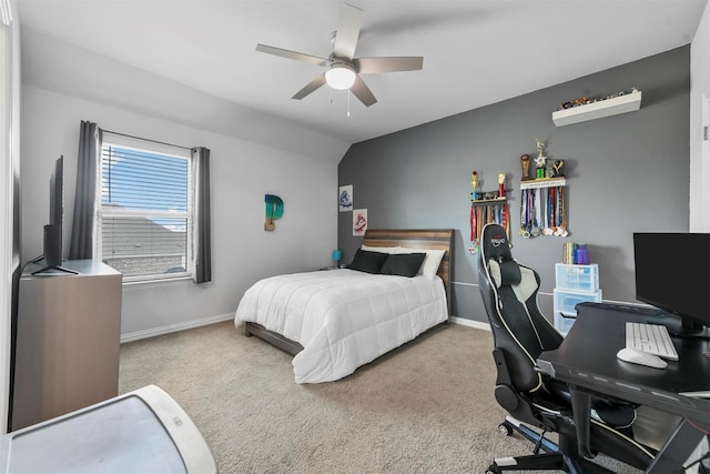 bedroom featuring light carpet, lofted ceiling, and ceiling fan