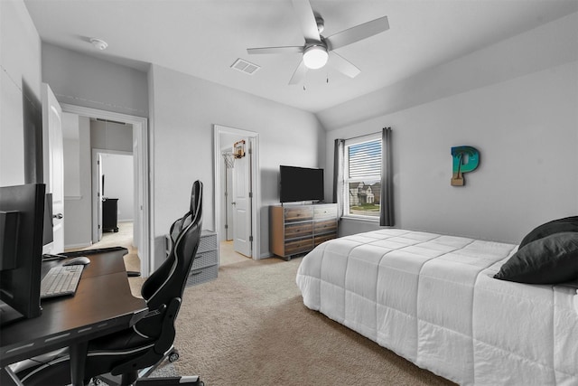 bedroom featuring ceiling fan, vaulted ceiling, and light carpet