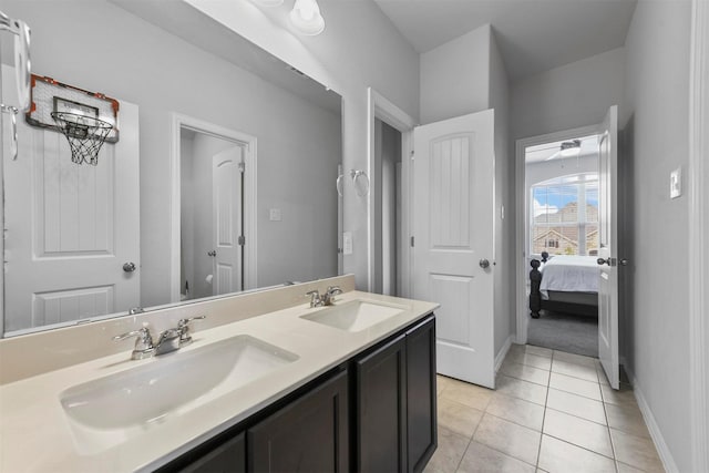 bathroom with tile patterned flooring and vanity