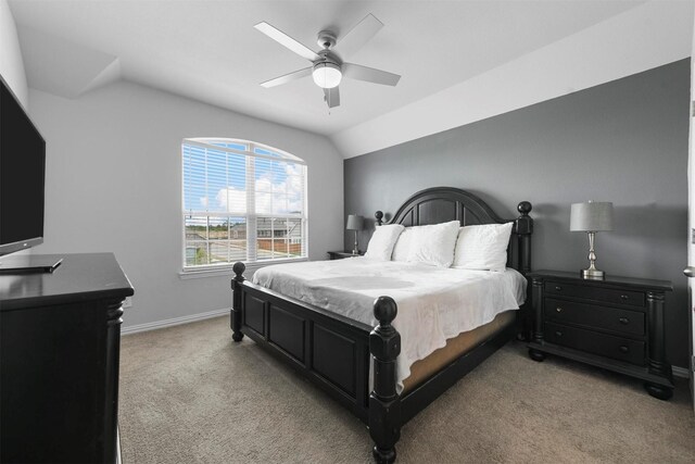 carpeted bedroom with ceiling fan and lofted ceiling