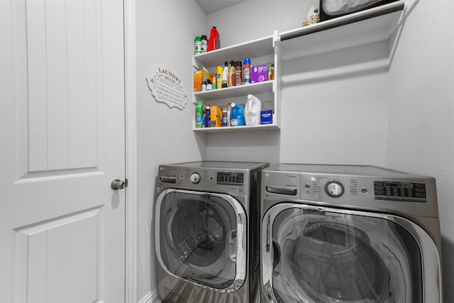 clothes washing area featuring separate washer and dryer