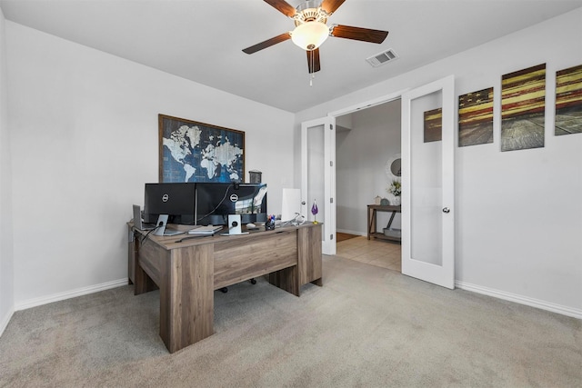 office area featuring light colored carpet and ceiling fan