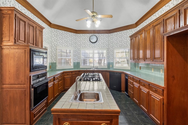 kitchen with ornamental molding, black appliances, sink, and tile countertops