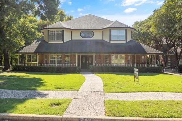 view of front of property with a front lawn and a porch