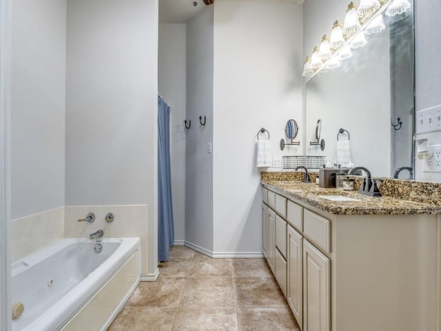 bathroom featuring tile patterned floors, a bath, and vanity