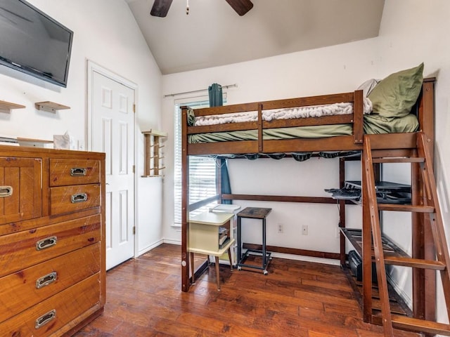 bedroom with lofted ceiling and dark hardwood / wood-style floors