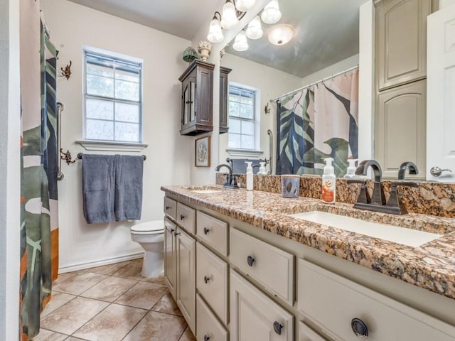 bathroom with vanity, tile patterned floors, toilet, and a shower with shower curtain