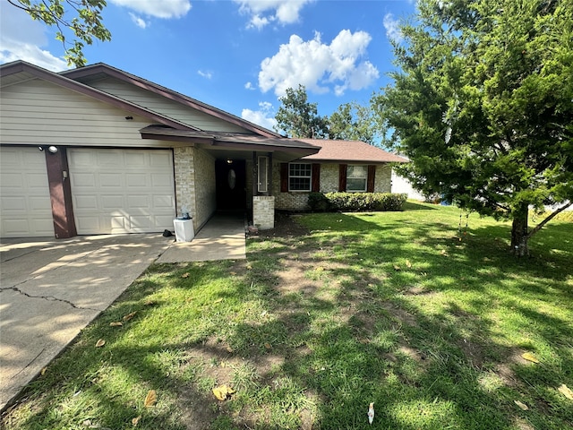 view of front of home with a garage and a front yard