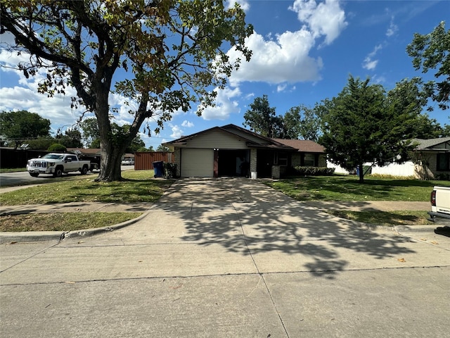 single story home featuring a garage, a front yard, concrete driveway, and fence