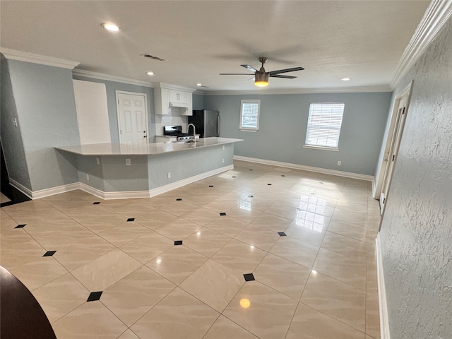 kitchen featuring light tile patterned floors, appliances with stainless steel finishes, tasteful backsplash, ceiling fan, and white cabinets