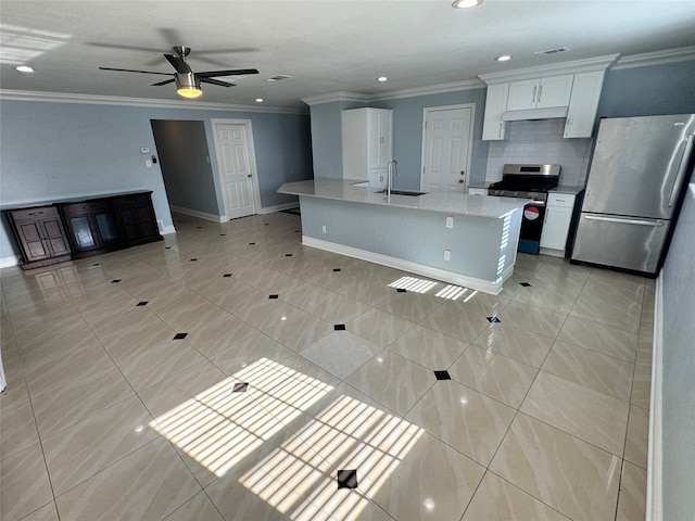 kitchen with light tile patterned floors, appliances with stainless steel finishes, ceiling fan, and white cabinetry