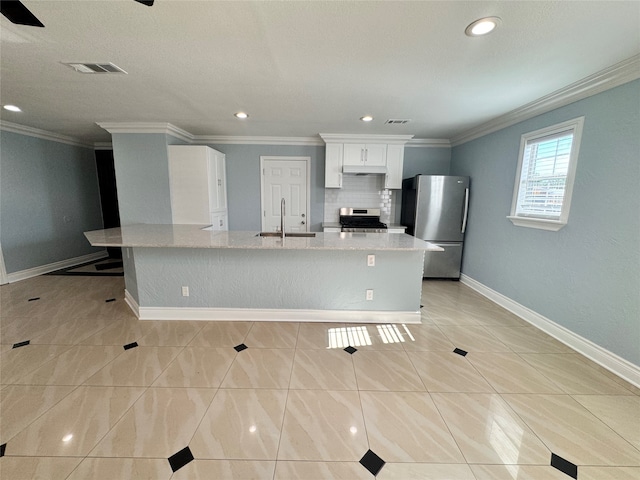 kitchen featuring decorative backsplash, sink, range, light tile patterned floors, and stainless steel fridge