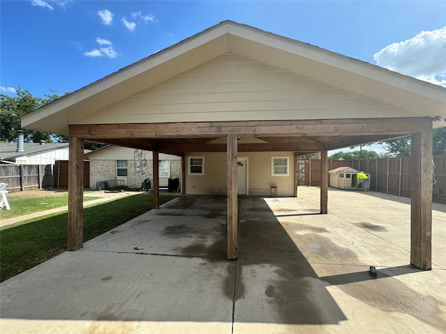 view of vehicle parking with a carport and a yard