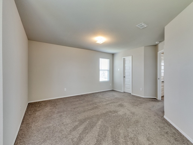 empty room with light colored carpet