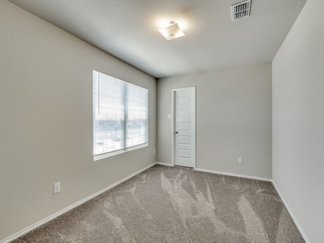 unfurnished room featuring carpet floors