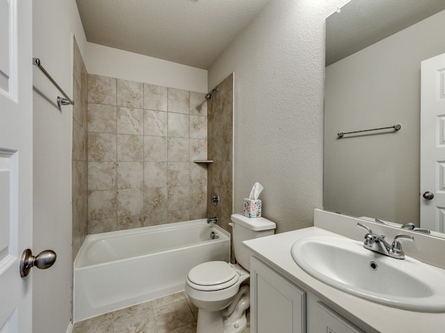 full bathroom featuring vanity, tile patterned flooring, a textured ceiling, tiled shower / bath, and toilet