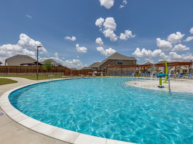 view of pool with pool water feature