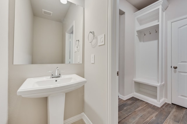 bathroom with hardwood / wood-style flooring and sink