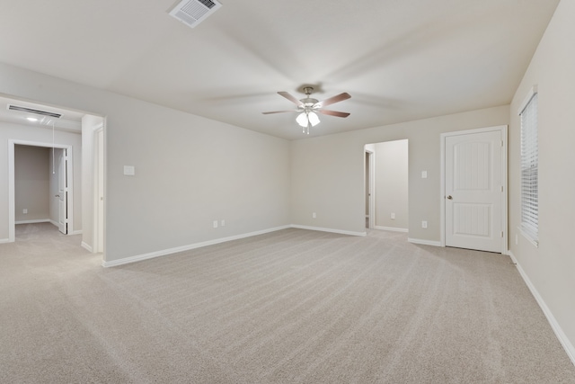 carpeted empty room featuring ceiling fan