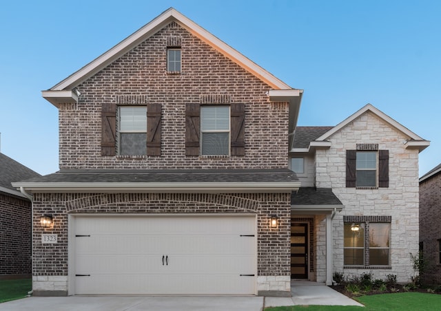 front of property featuring a garage