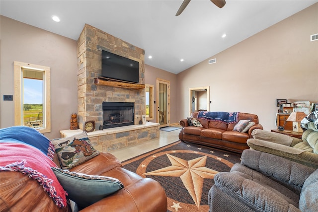 living area with visible vents, recessed lighting, a fireplace, and high vaulted ceiling